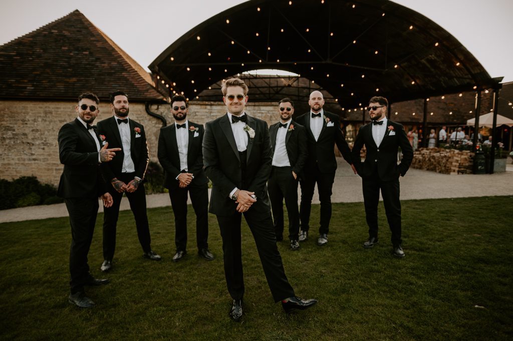 Adison and his Groomsmen gathered in the back garden of Old Gore // Yard Space. They are all wearing black tux which are timeless for any kind of wedding.