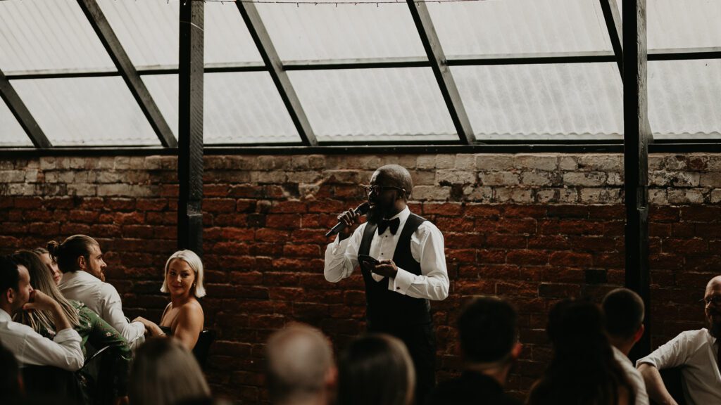 Groomsman gives a speech at the shack revolution.