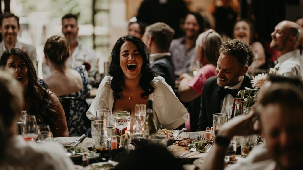 Bride reacts to a funny speech at her wedding at the shack revolution.