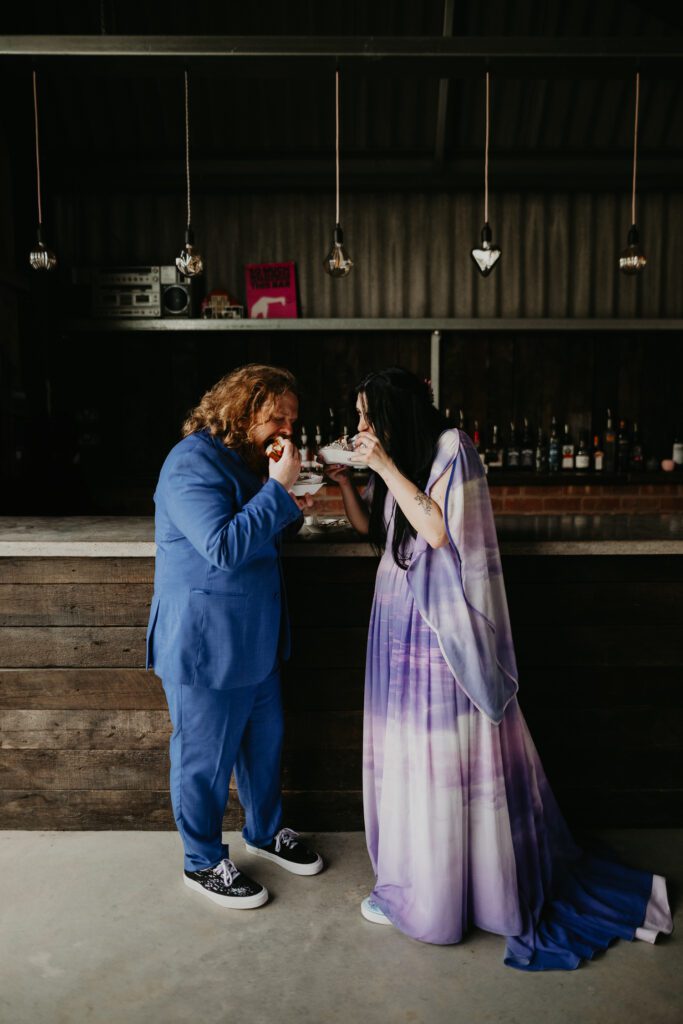 Bride and Groom each bao buns at their alternative wedding at The Giraffe Shed.