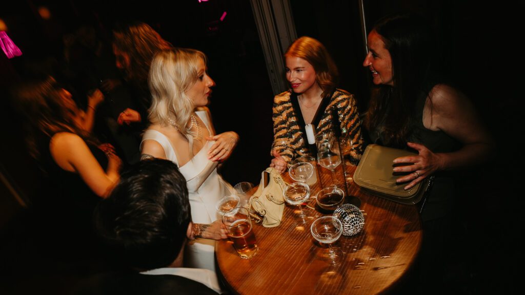 Bride talks to her wedding guests at her wedding at Ducie Street Warehouse in Manchester.