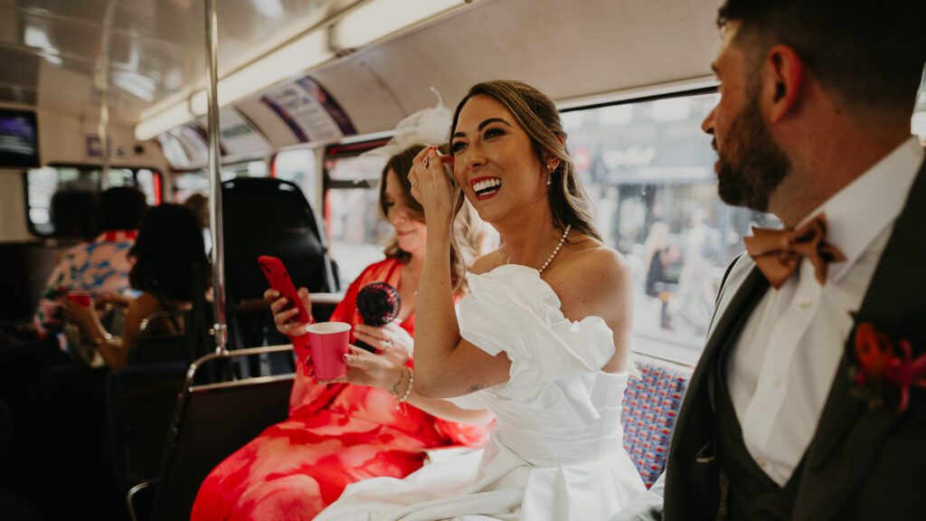 Bride on a Red London bus.