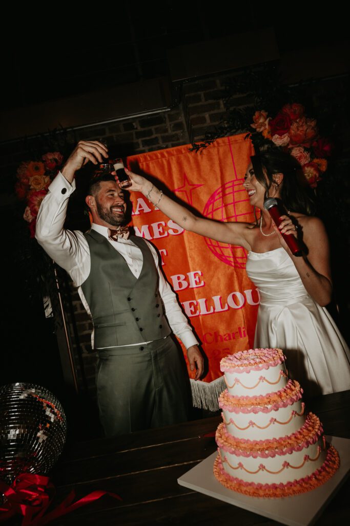 Bride and groom do a shot at Shoreditch Studios.
