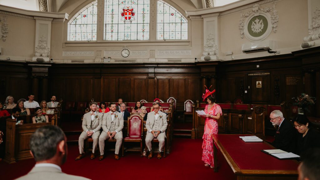 Wedding guest does a reading at Islington Town Hall.