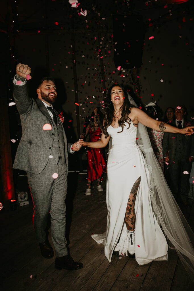 Tattooed bride and groom on the dance floor at their wedding in Newcastle.
