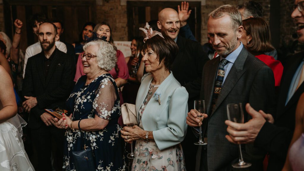 Mom listens to her daughter's speech at her wedding in London.
