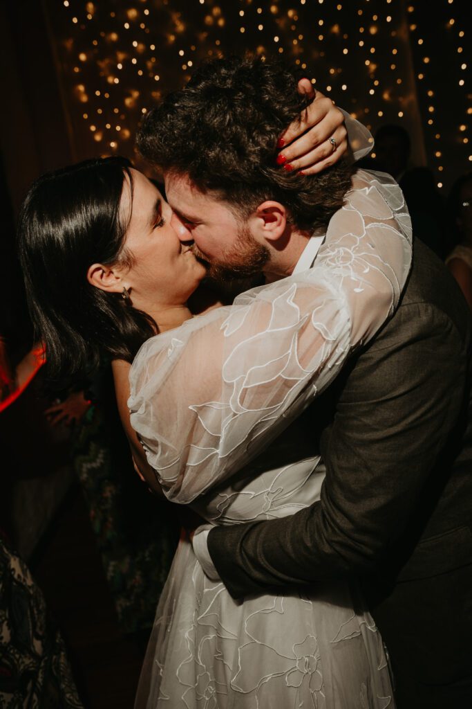 Bride and Groom kid. during their first dance at their wedding at the Paintworks in Bristol. 