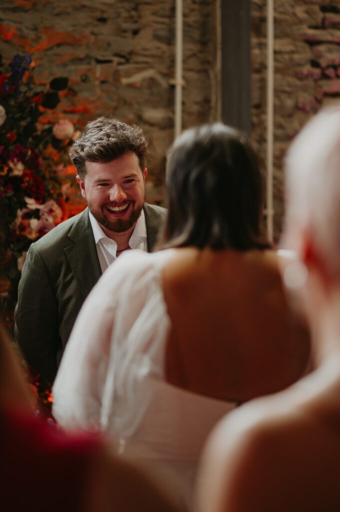 Groom sees his Bride walk down the aisle at their wedding at Paintworks in Bristol.