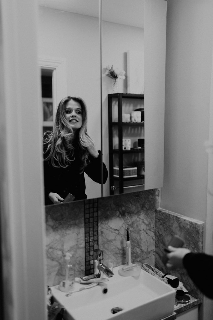 Bride gets ready in mirror