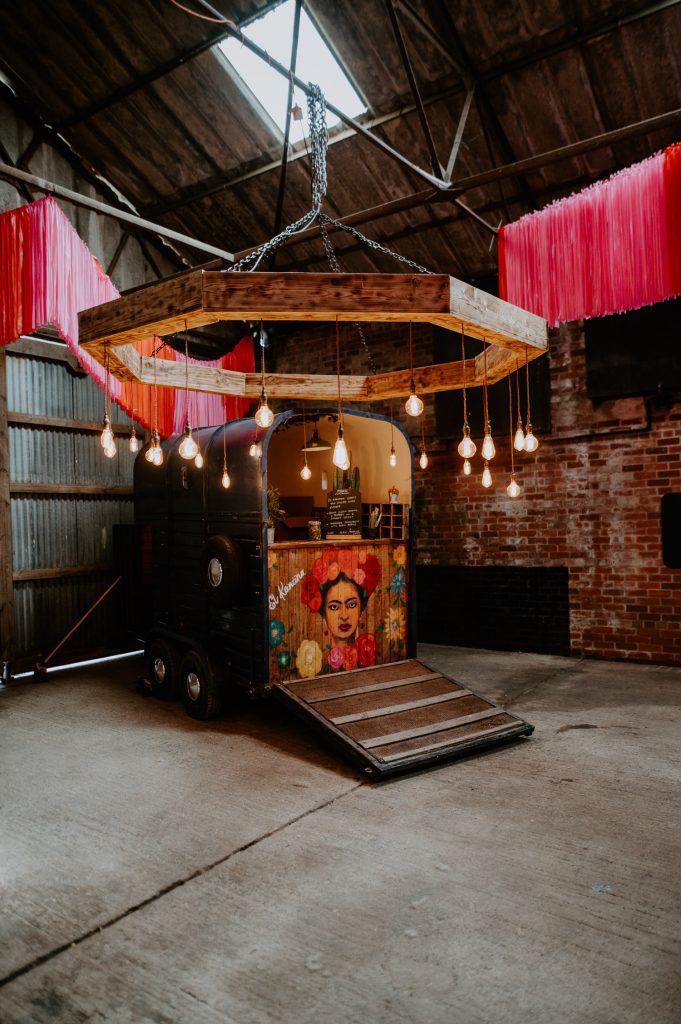 A Mexican food truck at a wedding.