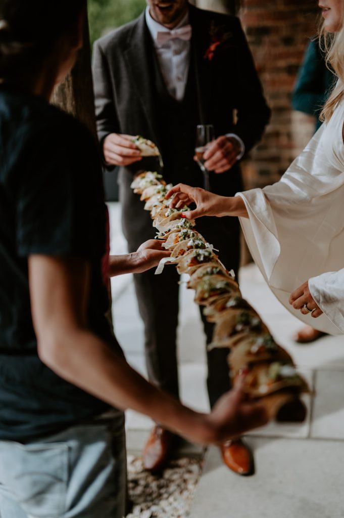 A pole full of vegan tacos are passed around at a wedding at White Syke Fields in York.