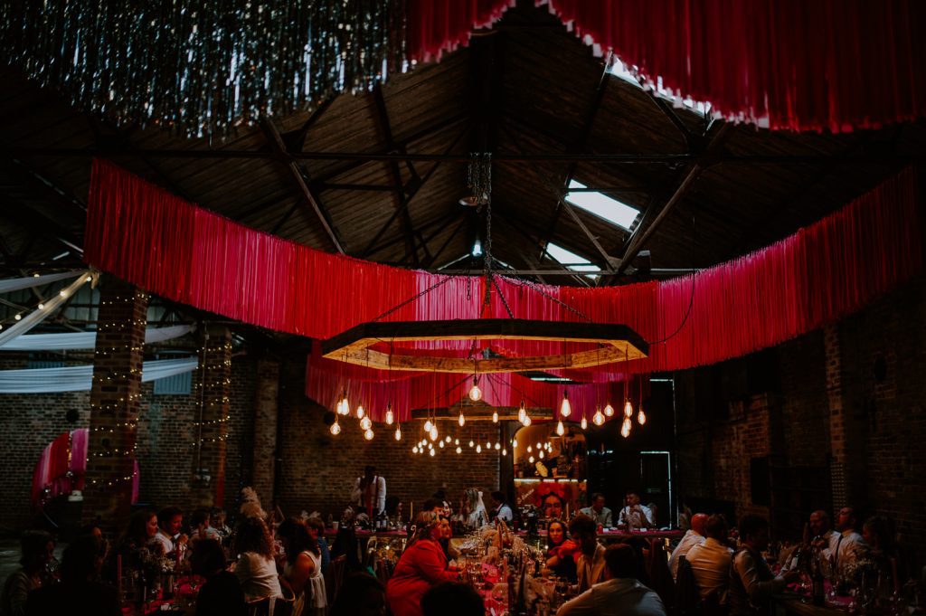 Wedding guests sitting at tables at White Syke Fields.