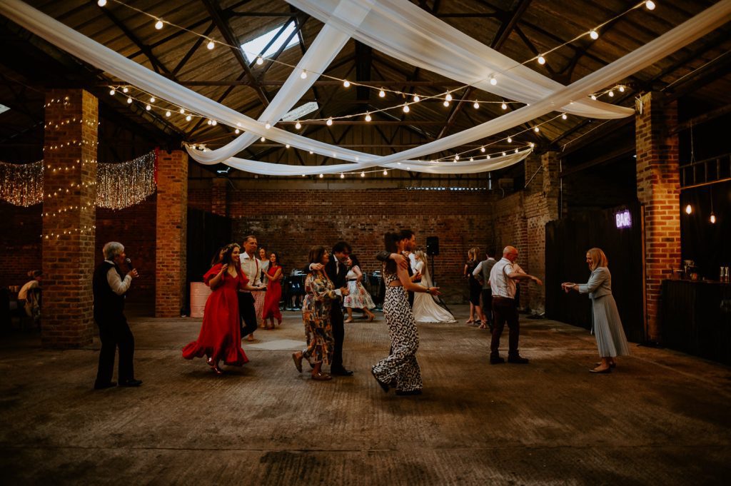 Wedding guests dance to a Ceilidh band at White Sykes Fields.