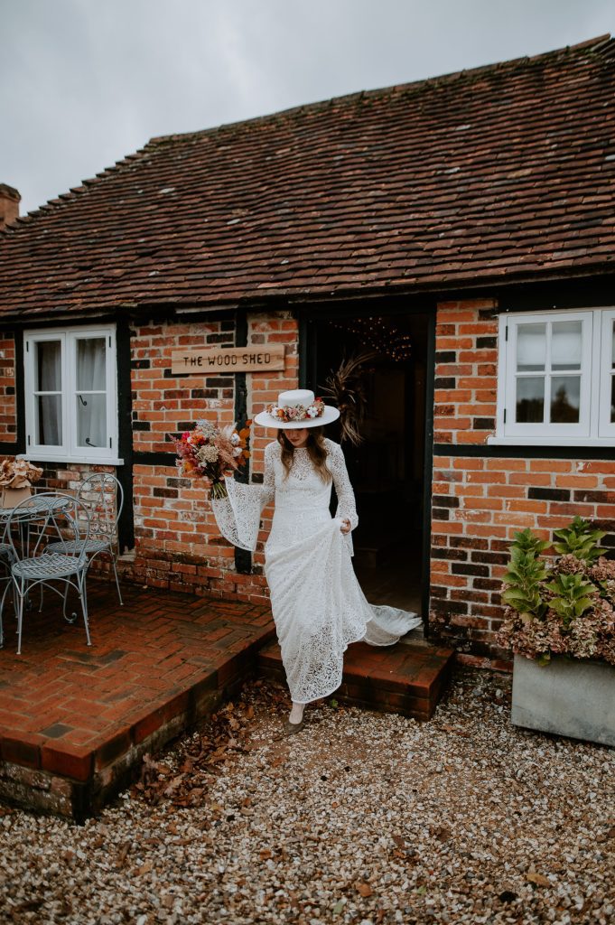 Bride exits the bridal suite at Silchester Farm for a first look with her soon to be husband.