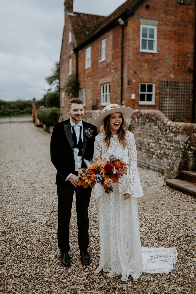 Bride and groom laugh during first look at Silchester Farm wedding.