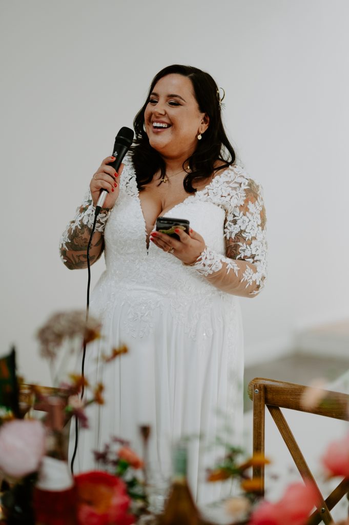 A tattooed bride delivers her wedding speech at Five Four Studios in Manchester.