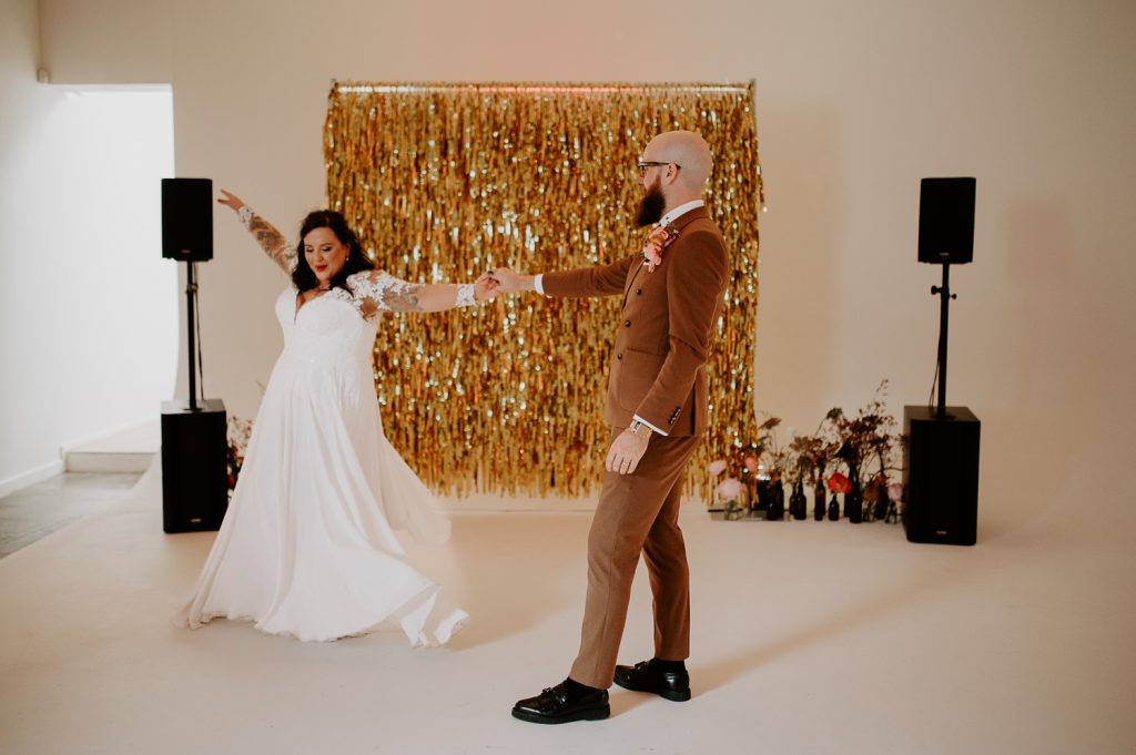 A bride and groom dance at their wedding reception at Five Four Studios in Manchester.