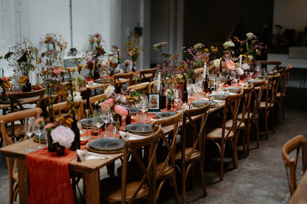 Chair set up for a stylishly colourful wedding breakfast at Five Four Studios.