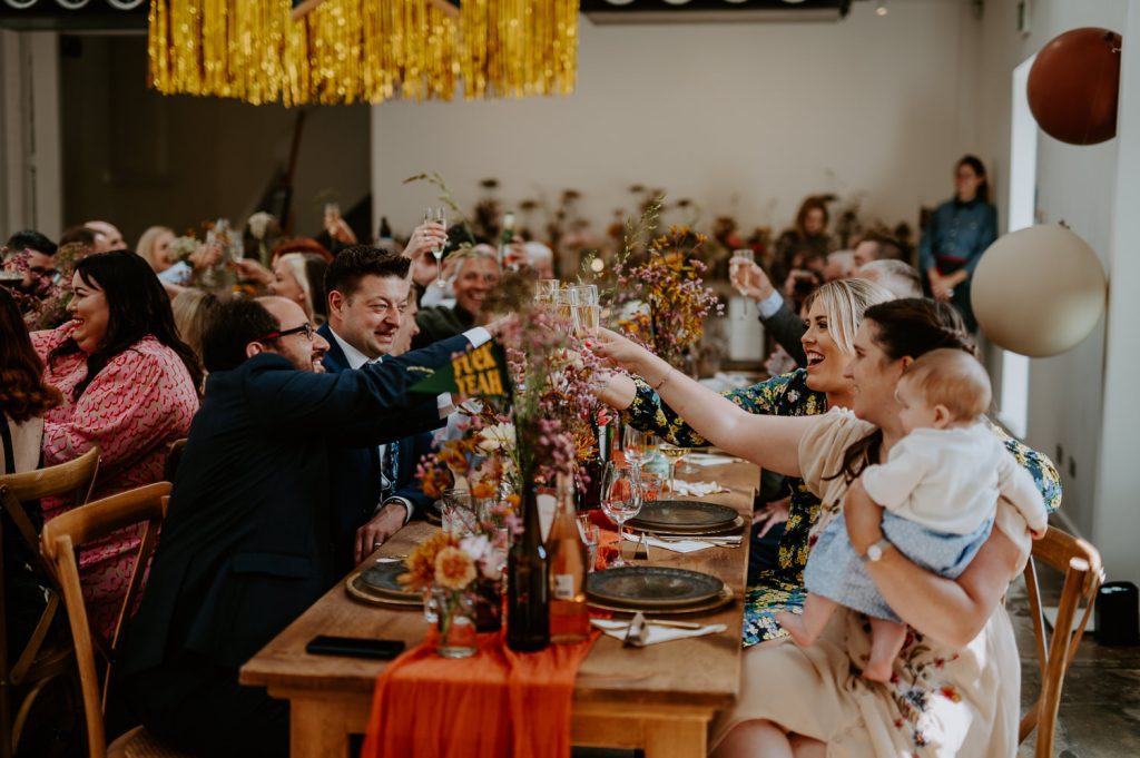 Guests cheering at a wedding at Five Four Studios