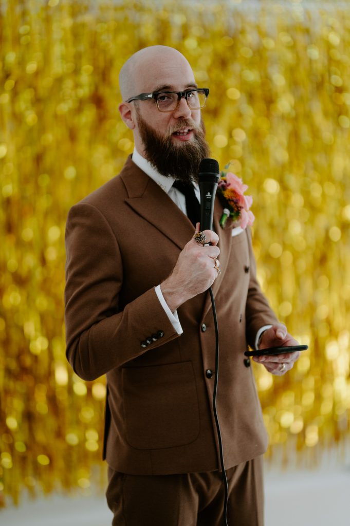 A groom delivering his speech at his stylishly colourful wedding at Five Four Studios.