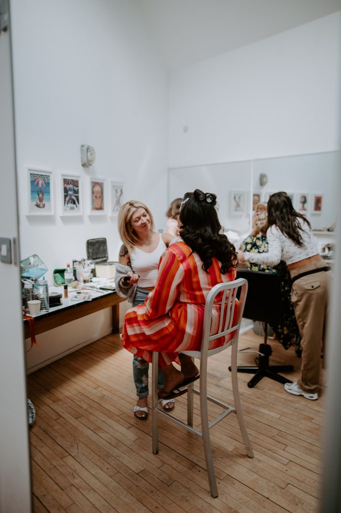 A bride getting her make up done at Five Four Studios.