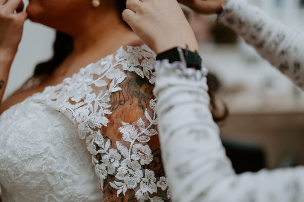 Detail shot of a lace wedding dress.