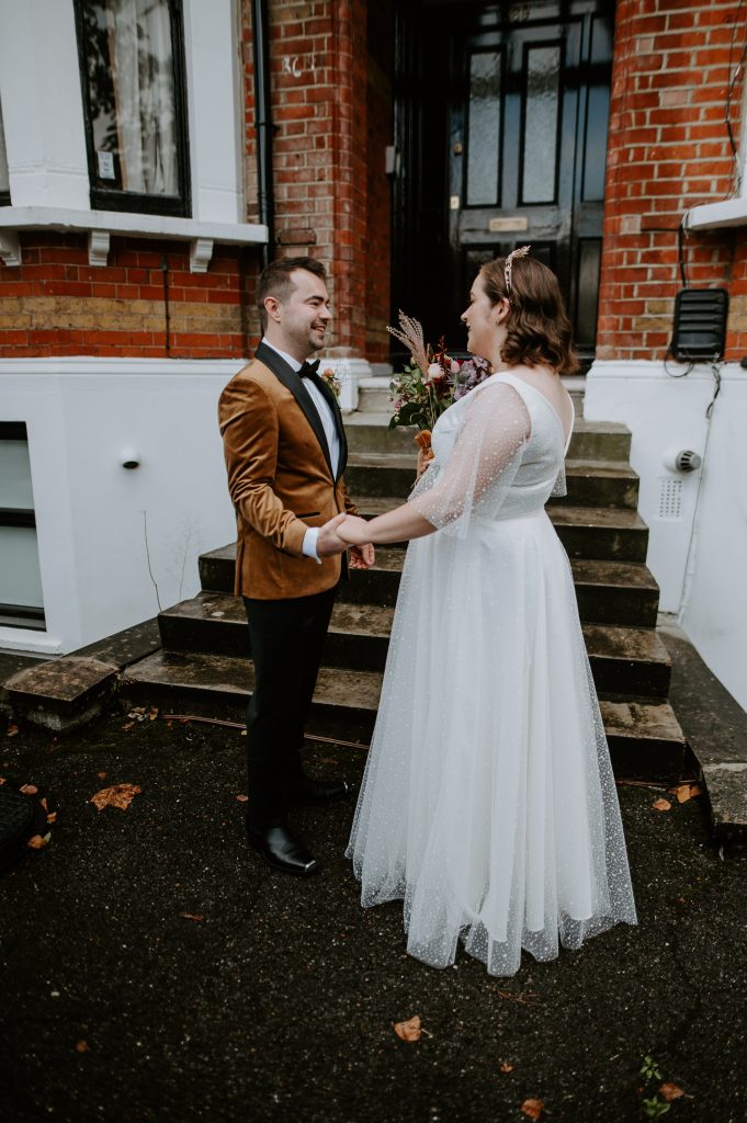 Bride and groom talk during their first look.