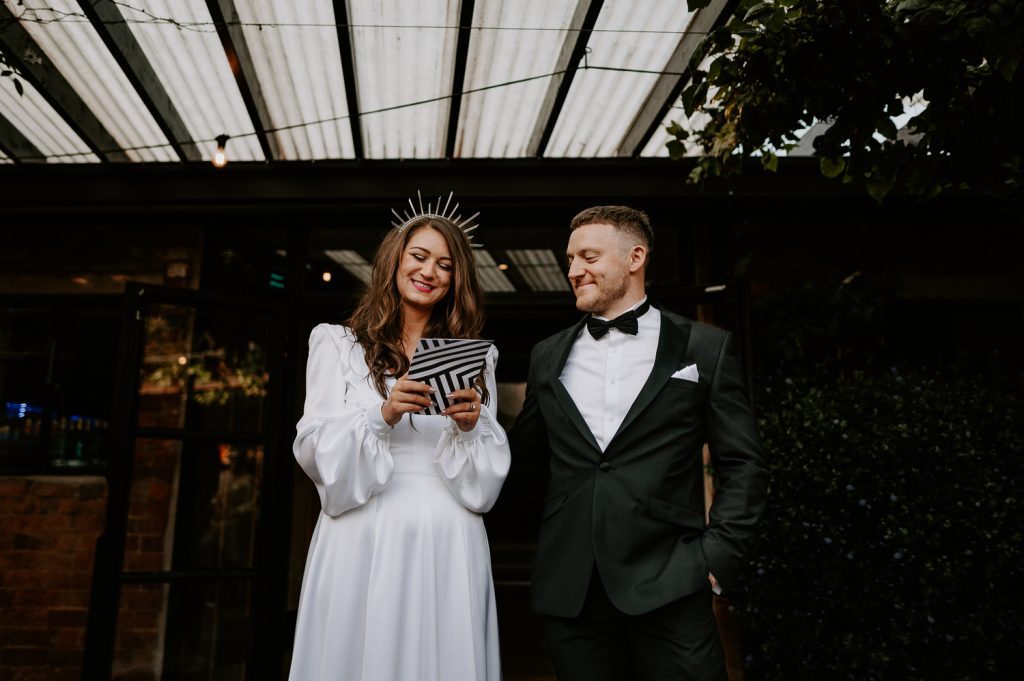 A bride delivers her speech on custom stationery at The Shack Revolution.